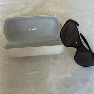 Sleek Black Sunglasses with White Case